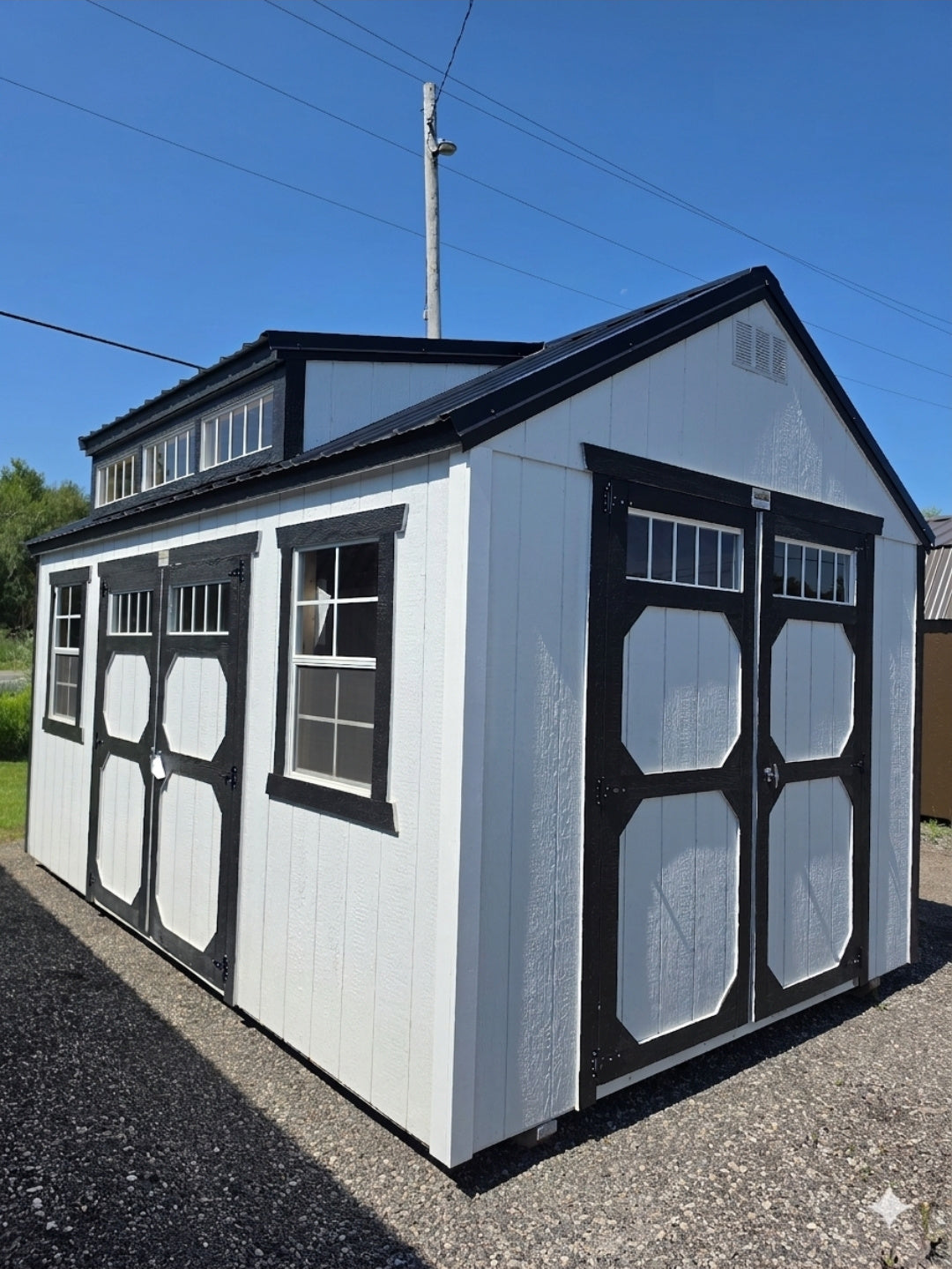 10x16 Utility Dormer shed with black trim at the Erin lot